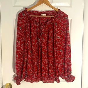 Floral swing top with tie front and elastic ruffle sleeves and hem